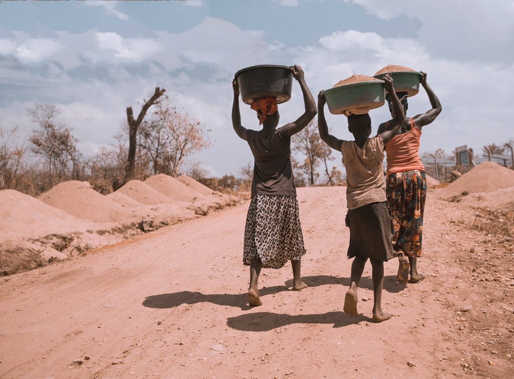 Three women in Rhino Refugee Camp, Arua, Uganda